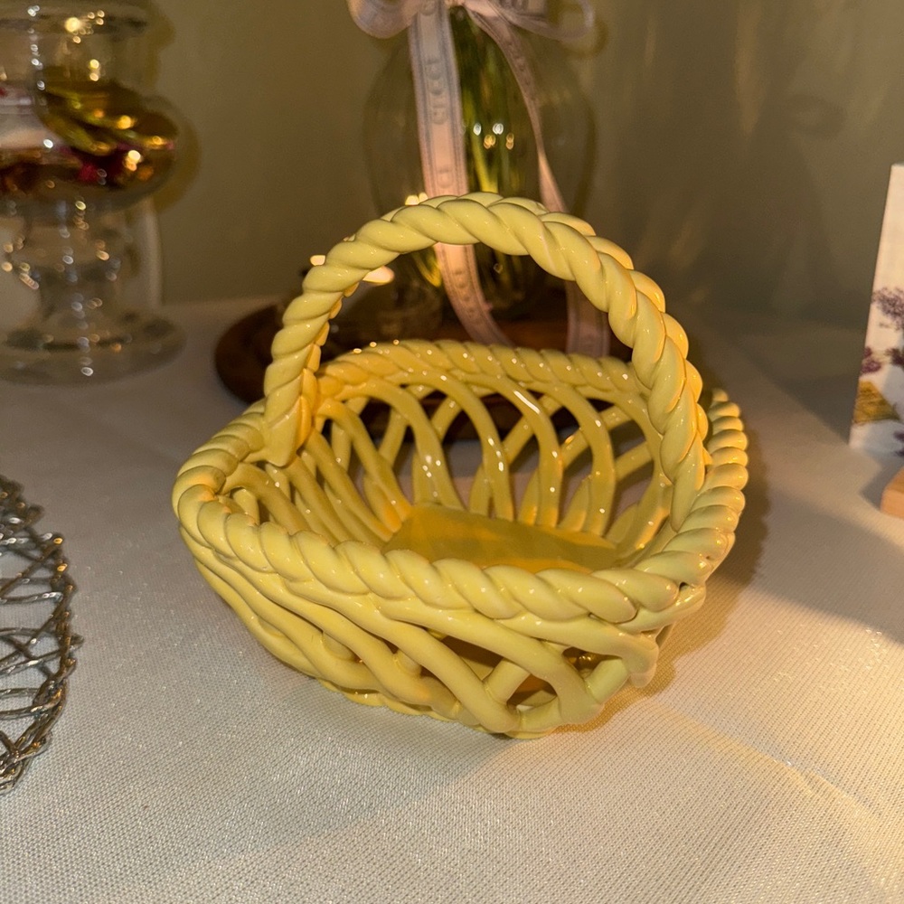 Vintage-style yellow decorative basket with handle